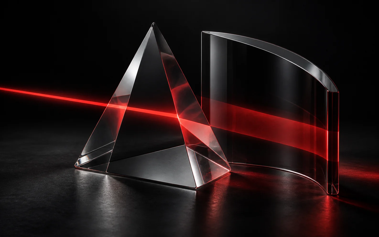 Red light refracting through clear and smoked glass.